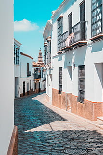 pathway, middle, houses, architecture, building, infrastructure, blue, sky, village, street, alley, sunny, day, house, building Exterior, residential Building, built Structure, outdoors, facade, residential District, window, urban Scene, town, no People, apartment, water, nature, city, sunlight, travel destinations, cloud - sky, sea, swimming pool, 5K, CC0, public domain, royalty free