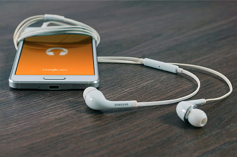 white, samsung android smartphone, table, samsung, smartphone, ear, earphones, android, mobile, google, cell phone, headphones, technology, cable, no people, music, close-up, day, outdoors, wireless technology, medical instrument, medical equipment, communication, stethoscope, medical supplies, connection, healthcare and medicine, wood - material, indoors, equipment, still life, portability, two objects, computer equipment, computer, 1080P, CC0, public domain, royalty free