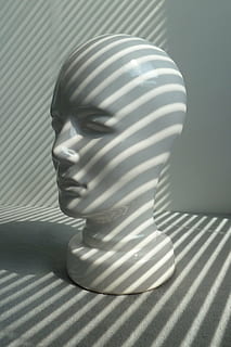 shadow, pattern, head, representation, no people, human representation, indoors, close-up, striped, single object, art and craft, sculpture, statue, still life, male likeness, creativity, white color, focus on foreground, sunlight, table, bust, 2K, CC0, public domain, royalty free