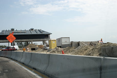 under construction, construction, toll booth, progress, street, building, sky, architecture, built structure, industry, construction site, construction industry, day, construction machinery, machinery, earth mover, road, cloud - sky, building exterior, development, transportation, nature, incidental people, outdoors, working, occupation, concrete, construction equipment, 4K, CC0, public domain, royalty free