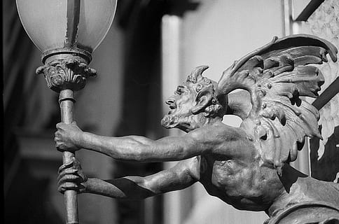 devil, holding, lamp statue, lamp, torch, architecture, mean, vicious, wings, focus on foreground, art and craft, representation, sculpture, statue, no people, close-up, creativity, day, human representation, metal, craft, indoors, old, nature, city, 2K, CC0, public domain, royalty free