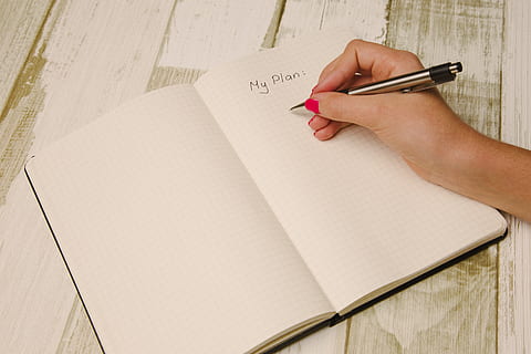 person, holding, silver, black, pen, arm, hand, desk, notebook, writing, write, to do, planner, organized, planning, human hand, human body part, one person, text, paper, note pad, indoors, copy space, education, close-up, writing instrument, document, handwriting, adult, list, studying, blank, finger, 5K, CC0, public domain, royalty free