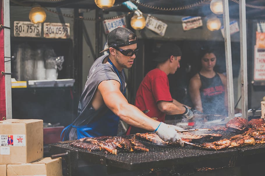 barbecue, bbq, chef, cooking, flame, food, market, meat, men, people, restaurant, smoke, food and drink, real people, preparation, standing, business, incidental people, freshness, small business, occupation, waist up, market stall, preparing food, barbecue grill, adult, street food, outdoors, 5K