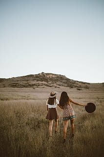 friends, girls, grass, hill, landscape, outdoors, people, women, adult, females, young Women, nature, caucasian Ethnicity, copy Space, togetherness, smiling, two People, happiness, enjoyment, young Adult, lifestyles, sky, land, leisure activity, field, clear sky, plant, environment, rear view, full length, casual clothing, day, positive emotion, couple - relationship, 5K