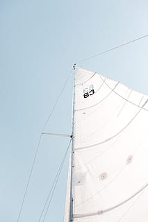 boat, sailing, flag, nautical vessel, mode of transportation, sailboat, transportation, sky, low angle view, pole, no people, mast, clear sky, nature, water, sea, ship, white color, day, sailing ship, copy space, outdoors, wind, yacht, rigging, power supply, 5K, CC0, public domain, royalty free