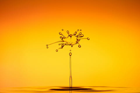 water photography, drip, spray, water, liquid, drop of water, orange, water splashes, yellow, drop, motion, splashing, purity, no people, close-up, freshness, nature, orange color, impact, studio shot, colored background, copy space, gold colored, indoors, falling, orange background, flowing, high-speed photography, 4K