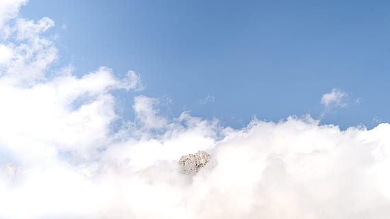 mountain between clouds, aerial, photography, clouds, sky, white clouds, blue sky, cloud, peak, nature, blue, weather, day, outdoors, air, cloud - Sky, summer, backgrounds, white, cumulus Cloud, climate, cloudscape, stratosphere, scenics, fluffy, heaven, space, meteorology, overcast, beauty in nature, white color, idyllic, scenics - nature, environment, bright, tranquility, sunlight, atmosphere, no people, softness, brightly lit, wind, 5K, CC0, public domain, royalty free