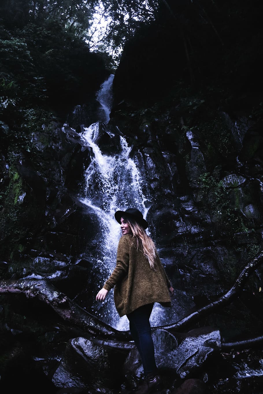 woman, brown, jacket, black, hat, waterfalls, standing, front, water, falls, daytime, waterfall, green, moss, tree, plant, nature, people, girl, smile, happy, outdoor, rock, wet, wood, adventure, rock - object, adults only, one person, adult, fear, outdoors, one man only, forest, lifestyles, real people, motion, leisure activity, solid, long exposure, flowing water, beauty in nature, scenics - nature, flowing, 5K