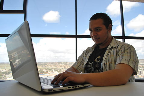 office, smart, computer, laptop, one person, window, using laptop, wireless technology, real people, technology, sitting, connection, table, furniture, communication, indoors, desk, day, cloud - sky, portrait, looking, 1080P, CC0, public domain, royalty free