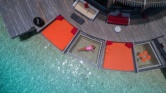 aerial, view photography, woman, floating, body, water, photograph, daytime, pool, deck, person, sunbathing, cushion, sunshine, warm, summer, hotel, resort, vacation, relax, pink, female, lady, young, girl, sparkle, high angle view, red, day, architecture, no people, built structure, building exterior, building, nature, outdoors, roof, orange color, sunlight, art and craft, city, directly above, house, swimming pool, 5K, CC0, public domain, royalty free