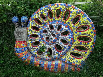 figure, snail, grim, evil, colorful, nature, spiral, sculpture, multi colored, plant, day, no people, grass, pattern, art and craft, field, creativity, design, outdoors, high angle view, shape, circle, land, geometric shape, close-up, ball, park, floral pattern, 2K, CC0, public domain, royalty free