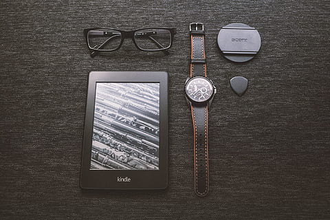 kindle, e-reader, technology, objects, watch, eyeglasses, accessories, table, communication, directly above, wireless technology, connection, no people, still life, indoors, smart phone, screen, portable information device, high angle view, wood - material, mobile phone, glasses, text, portability, western script, personal accessory, 1080P, CC0, public domain, royalty free