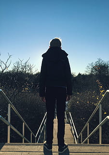 boy, standing, stairs, daytime, man, wearing, black, jacket, pants, brown, concrete, stair, blue, sky, clouds, tree, plant, nature, stairway, adventure, outdoor, travel, people, kid, sunny, day, rear view, railing, one person, one man only, adults only, adult, full length, only men, real people, lifestyles, men, leisure activity, clear sky, casual clothing, sunlight, architecture, outdoors, warm clothing, looking at view, 2K
