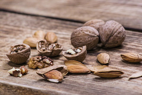 nuts, walnut, almond, walnuts, still life, food and drink, food, nut, wellbeing, wood - material, nut - food, healthy eating, nutshell, table, brown, close-up, dried food, large group of objects, freshness, no people, indoors, dried fruit, selective focus, focus on foreground, snack, 4K, CC0, public domain, royalty free