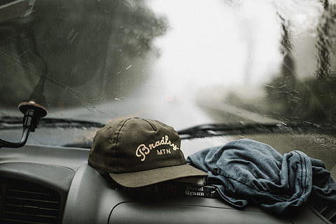 black, white, baseball cap, grey, shirt, top, glove compartment, inside, car, tilt-shift photography, cap, Life, Off Screen, trip, journey, excursion, rainy, transportation, outdoors, land Vehicle, mode of Transport, day, no people, nautical vessel, close-up, mode of transportation, glass - material, motor vehicle, vehicle interior, indoors, text, communication, windshield, car interior, travel, western script, window, transparent, nature, message, road trip, 5K, CC0, public domain, royalty free