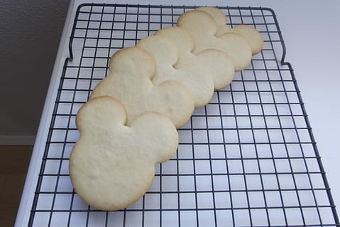 Mickey Mouse, Cookie, Baking, mickey mouse cookie, mouse ears, sugar cookie, cutout, sugar cookie cutout, cooling rack, food and drink, preparation, sweet food, food, high angle view, indoors, heart shape, freshness, still life, no people, baked, close-up, indulgence, temptation, ready-to-eat, large group of objects, shape, unhealthy eating, love, snack, baking sheet, preparing food, 2K, CC0, public domain, royalty free