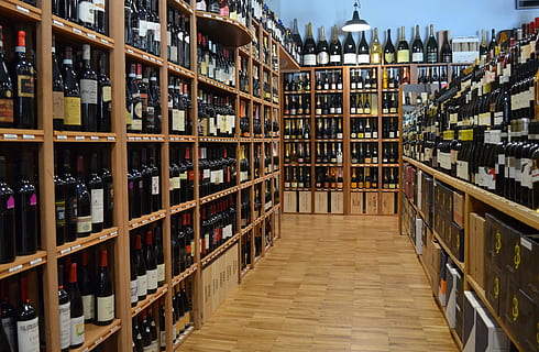 ground, blanket, wall, wine Bottle, alcohol, shelf, wine, cellar, winery, bottle, drink, store, warehouse, wine Rack, storage Room, merchandise, in A Row, red Wine, retail, refreshment, container, large group of objects, indoors, food and drink, abundance, choice, rack, variation, architecture, order, arrangement, no people, bookshelf, liquor store, 1080P, CC0, public domain, royalty free