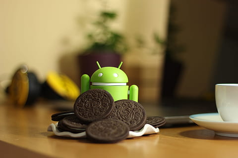 android toy, beside, oreo cookies, table, android, oreo, coffee, no people, indoors, food and drink, selective focus, animal representation, still life, close-up, representation, food, wood - material, focus on foreground, coin, wealth, finance, business, animal, stack, currency, crockery, tea cup, 5K, CC0, public domain, royalty free