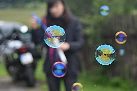 bubble blower, bubbles, pleasure, bubble, childhood, mid-air, soap sud, fragility, sphere, vulnerability, transparent, bubble wand, offspring, nature, day, child, focus on foreground, reflection, outdoors, one person, holding, multi colored, blowing, innocence, 2K, CC0, public domain, royalty free