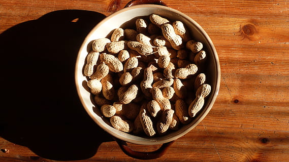 peanuts, shell, table, delicious, peanut, food, nutrition, nutshell, nuts, nut, eat, food and drink, wood - material, bowl, freshness, indoors, large group of objects, healthy eating, still life, brown, wellbeing, nut - food, directly above, no people, abundance, high angle view, close-up, dried fruit, snack, wood grain, 4K, CC0, public domain, royalty free