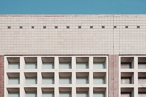 beige concrete building, architecture, building, infrastructure, structure, establishment, apartment, windows, condominium, hotel, building exterior, built structure, outdoors, day, no people, window, pattern, low angle view, nature, residential district, full frame, roof, geometric shape, modern, city, blue, architectural feature, office, office building exterior, swimming pool, 4K, CC0, public domain, royalty free