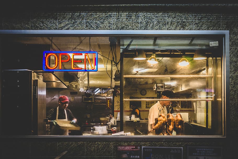 woman, standing, inside, diner, store, meat, shop, restaurant, people, men, chef, night, open, signage, illuminated, text, glass - material, window, transparent, communication, reflection, city, western script, sign, architecture, building exterior, real people, store window, business, outdoors, 5K