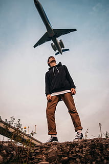man, looking, flying, airplane, daytime, low, angle photography, standing, airline, boy, plane, nature, portrait, outfit, van, looking up, feel, beautiful, one person, real people, full length, sky, lifestyles, men, casual clothing, leisure activity, young men, young adult, males, day, land, front view, field, outdoors, 5K, CC0, public domain, royalty free