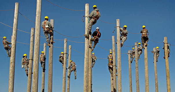 group, men, wearing, gray, black, coveralls, climbing, electrical, post, daytime, workers, training, pole, hardhat, job, helmet, labor, sky, nature, day, no people, clear sky, cable, plant, blue, outdoors, tree, industry, yellow, sunlight, low angle view, fuel and power generation, metal, barrier, non-urban scene, electricity, boundary, wooden post, 2K, CC0, public domain, royalty free