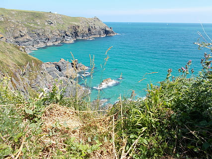 cornwall, sea, seascape, landscape, coastline, england, coast, beach, water, rocks, waves, sand, cornish, bay, coastal, blue, places, beaches, sunshine, beauty in nature, scenics - nature, horizon over water, plant, tranquil scene, tranquility, horizon, nature, day, land, rock, sky, high angle view, non-urban scene, no people, rock - object, outdoors, 4K, CC0, public domain, royalty free