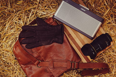 bag, bose, camera, gloves, leather, lens, sling bag, speaker, speaker dock, wood, high angle view, still life, no people, brown, technology, table, directly above, indoors, photography themes, wireless technology, camera - photographic equipment, book, fashion, black color, publication, glasses, wood - material, communication, personal accessory, 1080P, CC0, public domain, royalty free