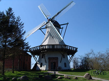 mill, wind, windmill, wing, turn, renewable energy, environmental conservation, fuel and power generation, alternative energy, sky, wind power, tree, environment, wind turbine, turbine, plant, built structure, architecture, nature, traditional windmill, clear sky, day, grass, no people, blue, 2K, CC0, public domain, royalty free