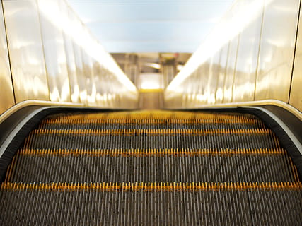 high, angle view, escalator, down, moving, mall, transport, yellow, blue, perspective, architecture, indoors, airport, station, transportation, modern, staircase, railing, the way forward, no people, empty, direction, connection, metal, convenience, pattern, technology, absence, illuminated, built structure, moving walkway, 2K, CC0, public domain, royalty free