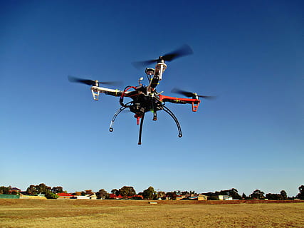 red, black, drone, flying, air, uav, remote, control, aircraft, aerial, unmanned, vehicle, copter, sky, wireless, multicopter, quadrocopter, multirotor, photography, air vehicle, blue, photography themes, transportation, technology, mid-air, clear sky, nature, mode of transportation, camera - photographic equipment, propeller, no people, surveillance, motion, security, helicopter, hovering, big brother - orwellian concept, aerospace industry, 4K, CC0, public domain, royalty free