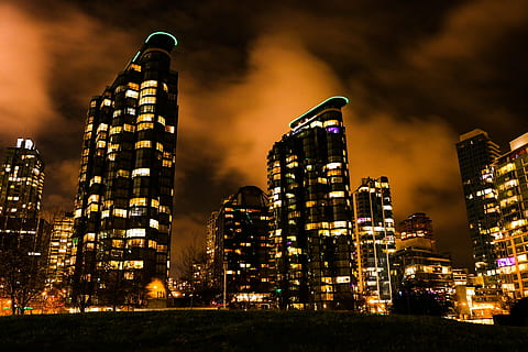 lightened, high, rise building, nighttime, night, clouds, skyline, skyscraper, vancouver, downtown, illuminated, building exterior, industry, no people, urban skyline, cityscape, architecture, city, built structure, building, office building exterior, sky, residential district, landscape, modern, street, city life, nature, tall - high, outdoors, financial district, dark, nightlife, apartment, 1080P, CC0, public domain, royalty free
