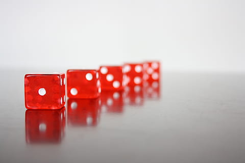 five red-and-white dices, cube, red, play, random, luck, poker game, gambling, cube table, leisure Games, dice, opportunity, close-up, arts culture and entertainment, indoors, copy space, no people, leisure activity, relaxation, studio shot, risk, success, group of objects, cube shape, in a row, table, 4K, CC0, public domain, royalty free