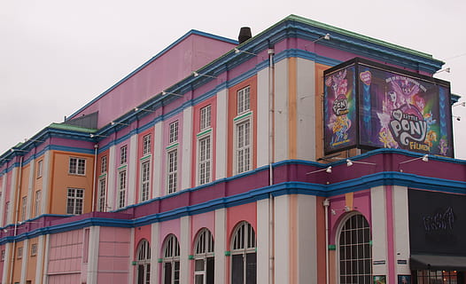 cinema, colorful, façade, windows, architecture, built structure, building exterior, building, sky, window, city, residential district, multi colored, no people, low angle view, day, nature, pink color, outdoors, house, clear sky, red, the past, arch, 2K, CC0, public domain, royalty free