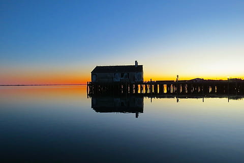 brown, wooden, house, middle, body, water, provincetown, cape cod, wharf, sunset, massachusetts, landscape, nature, outdoors, scenic, seascape, sea, ocean, beach, sky, reflection, architecture, built structure, waterfront, tranquility, no people, beauty in nature, scenics - nature, clear sky, tranquil scene, building exterior, copy space, 4K, CC0, public domain, royalty free
