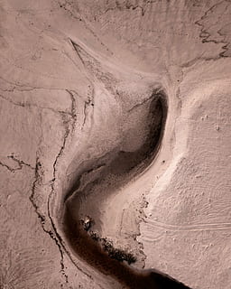 photo, beige, crevice, aerial, land formation, daytime, sand, dirt, pattern, river, water, topdown, tan, brown, drone, creative, maritime, no people, rock, non-urban scene, rock - object, nature, tranquility, geology, scenics - nature, beauty in nature, land, day, solid, environment, rock formation, desert, physical geography, landscape, mountain, outdoors, textured, climate, arid climate, sandstone, eroded, power in nature, 2K, CC0, public domain, royalty free
