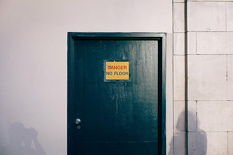 green door, danger, door, shadow, wall, white, people, text, communication, western script, sign, wall - building feature, entrance, architecture, built structure, no people, safety, non-western script, script, building exterior, warning sign, day, information, close-up, protection, closed, message, 2K
