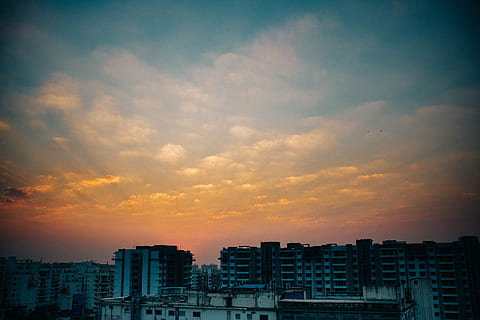 buildings, cloudy, sky, high, rise, golden, hour, sunset, dusk, clouds, apartments, city, urban, cityscape, architecture, building exterior, skyscraper, no people, residential, outdoors, built structure, building, cloud - sky, residential district, nature, city life, dramatic sky, urban skyline, landscape, sun, cloudscape, sunlight, apartment, romantic sky, office building exterior, 2K