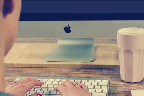 person hand, apple keyboard, silver, imac, monitor, apple, wireless, keyboard, near, tumbler, working, typing, mac, desktop, computer, office, desk, business, technology, indoors, one person, human body part, human hand, table, adults only, real people, adult, close-up, people, body part, lifestyles, hand, personal perspective, women, leisure activity, nail polish, nail, food and drink, human leg, finger, human finger, human foot, human limb, 1080P, CC0, public domain, royalty free