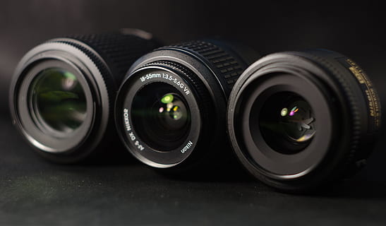Lenses, Nikon, Sharpness, Light, telephoto lens, fix, 35 mm, 18-55 mm, 70-200 mm, black background, no people, tire, indoors, close-up, day, lens - optical instrument, photography themes, technology, wheel, camera - photographic equipment, black color, industry, group of objects, circle, geometric shape, shape, photographic equipment, still life, lens - eye, selective focus, digital camera, 4K, CC0, public domain, royalty free