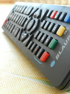 macro, remote control, black, close-up, no people, still life, indoors, communication, technology, text, high angle view, table, black color, western script, multi colored, single object, computer equipment, computer part, connection, pattern, art and craft, computer, sign, matchstick, 4K, CC0, public domain, royalty free