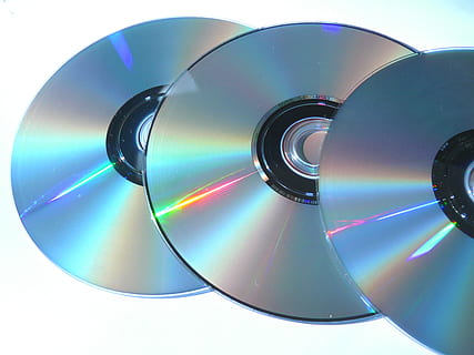three compact discs, Computer, Pc, Object, Dvd, Media, dvds, data, audio, no people, sport, white background, technology, close-up, day, geometric shape, circle, shape, compact disc, multi colored, indoors, design, digital composite, pattern, architecture, shiny, arts culture and entertainment, reflection, abstract, studio shot, music, 2K, CC0, public domain, royalty free