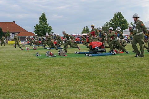 fire, competition, competitions, fire fighting attack, firefighter competition, plant, grass, group of people, real people, crowd, large group of people, men, sky, tree, cloud - sky, nature, day, green color, field, leisure activity, women, land, architecture, lifestyles, 2K, CC0, public domain, royalty free
