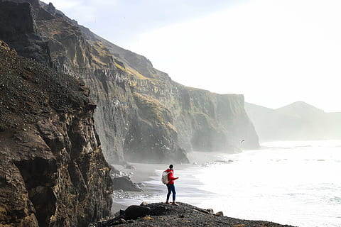 action, beach, cliff, daylight, hike, hiker, island, landscape, man, mountain, nature, ocean, outdoors, person, recreation, rock, rocks, scenic, sea, seascape, seashore, summer, travel, water, hiking, people, sport, adventure, one person, beauty in nature, scenics - nature, standing, lifestyles, rock - object, solid, leisure activity, sky, adult, full length, rear view, mountain range, 4K