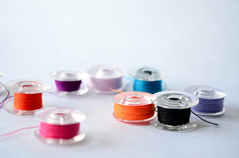 assorted-color threads, clear, plastic reels, spools, thread, sewing, sew, textile, needlework, craft, tailor, bobbin, studio shot, no people, group of objects, indoors, close-up, choice, copy space, white background, healthcare and medicine, variation, medium group of objects, colored background, still life, research, multi colored, education, selective focus, blood, science, blue background, 4K, CC0, public domain, royalty free