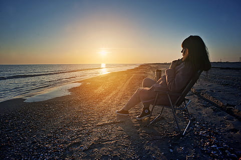 light, sea, dawn, landscape, beach, breeze, clouds, day, daybreak, dusk, evening, female, girl, horizon, hot, lady, ocean, outdoors, peace, peaceful, relax, relaxation, sand, scenery, seascape, seashore, sit, sitting, sky, summer, sun, sunrise, sunset, travel, vacation, water, woman, land, women, adult, leisure activity, one person, nature, chair, young adult, sunlight, holiday, beauty in nature, horizon over water, hairstyle, 4K, CC0, public domain, royalty free