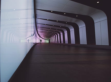 person, walking, empty, hallway, building, architecture, modern, art, structure, odd, shapes, linear, lines, patterns, perspective, hall, corridor, man, people, walls, reflection, transportation, indoors, no people, day, the way forward, built structure, direction, flooring, in a row, illuminated, diminishing perspective, absence, ceiling, arcade, public transportation, rail transportation, architectural column, 4K
