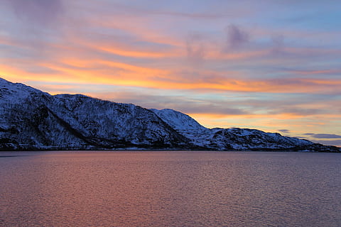 mountain, beside, body, water, golden, hour, sunset, ever-changing, orange, red, blue, reflection, amazing, beautiful, sea, fjord, snow, winter, travel, lauklines kystferie, kvaloya, kvaløysletta, norway, tromso, scandinavia, europe, nature, landscape, sky, scenics, dusk, outdoors, beauty in nature, scenics - nature, environment, cloud - sky, tranquil scene, tranquility, no people, cold temperature, lake, idyllic, non-urban scene, snowcapped mountain, 2K, CC0, public domain, royalty free